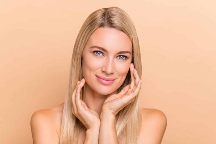 woman showing off Botox - Manhattan Aesthetics